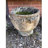 A large circular reconstituted stone planter. W:48cm x D:48cm x H:43cm