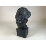 A painted plaster oriental style bust on square plinth W:22cm x H:43cm