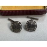 A pair of cuff links white metal marked 950.