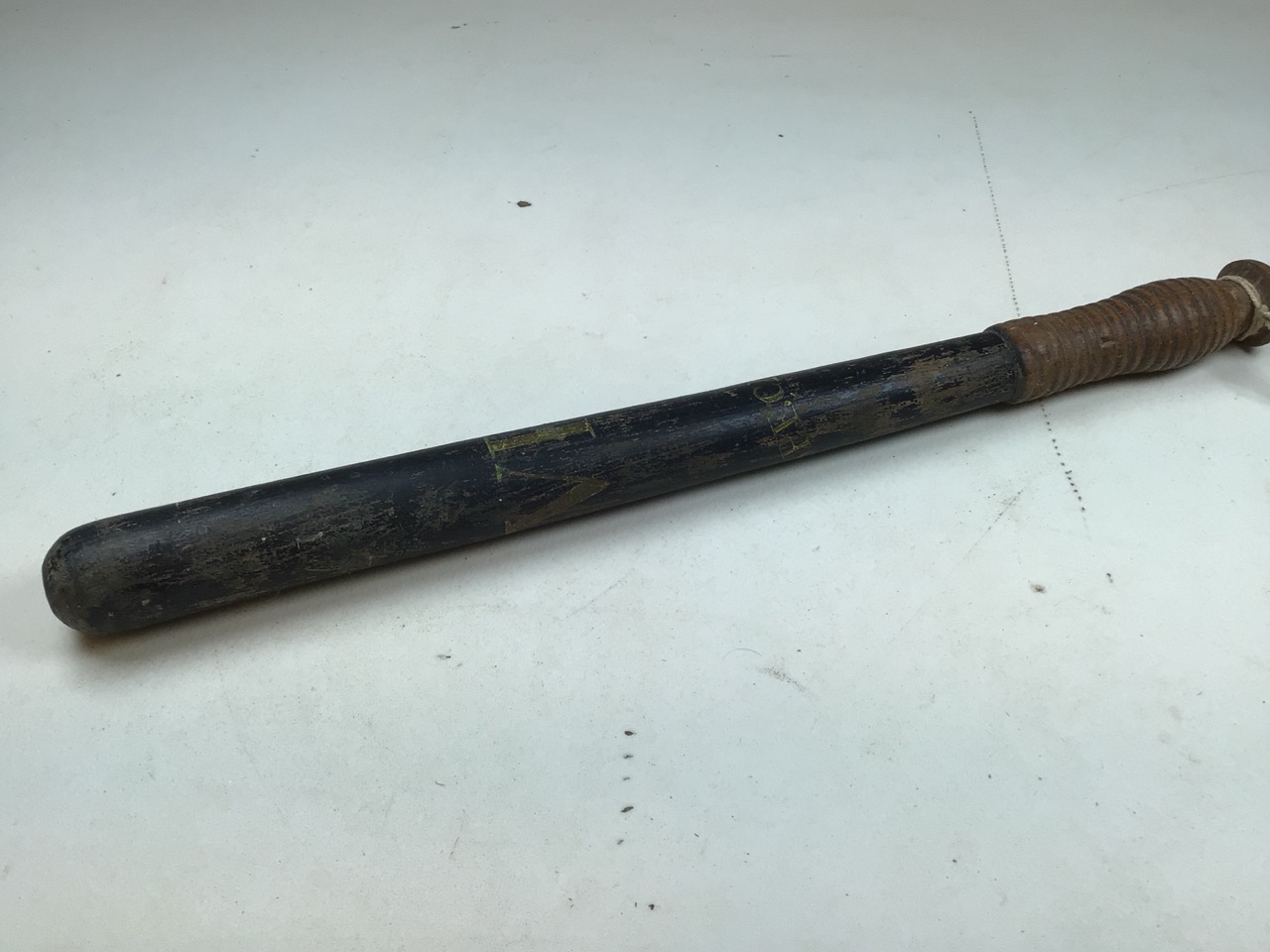 A Victorian Police truncheon, thought to be Metropolitan. Turned wood painted in black with gilt/