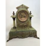 An large onyx mantle clock with brass ormolu mounts. W:36cm x D:16cm x H:37cm