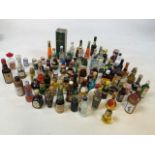 A large collection of miniatures including rum, port, whisky and tequila. A few empties for