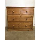 A Victorian pine chest of drawers with two short over two long drawers with turned handles. W:98cm x