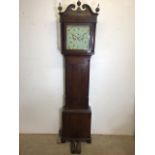 An 8 day mahogany longcase clock with weights and pendulum and key with painted face depicting birds