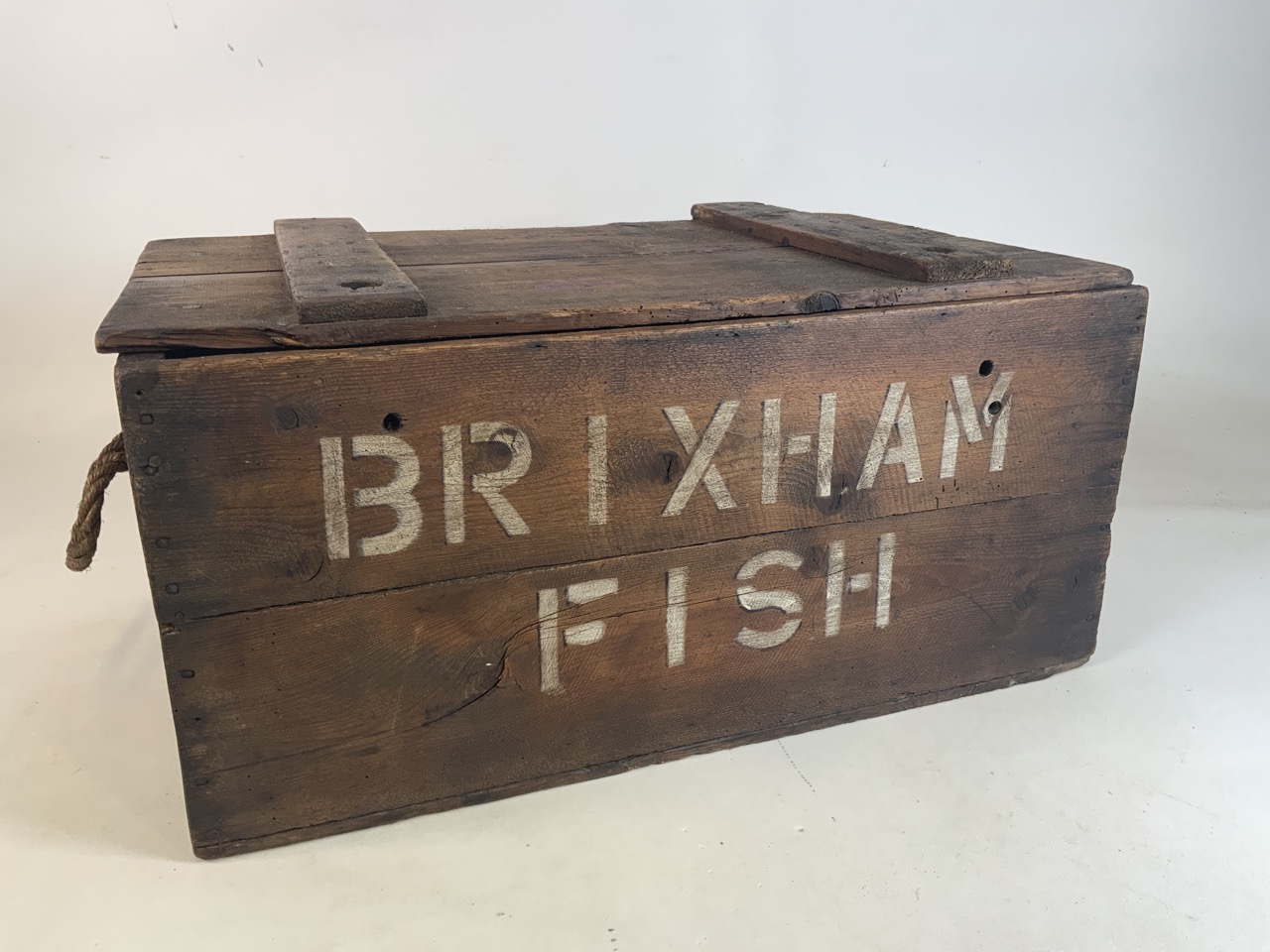 A vintage wooden fish box with rope handles and Brisbaneâ€™s Fish stencilled to front W:70cm x D: