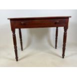 A 19th century stained pine hall table with turned legs and large central drawer. W:90cm x D:47cm