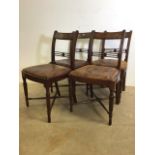 A set of four Victorian bar back dining chairs with reeded legs and cross stretchers to base.
