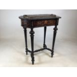 A 19th Century Dutch marquetry inlaid mahogany side table with tin lined lidded top possibly