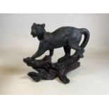 A metal and gesso sculpture of a panther on a branch. W:50cm x D:25cm x H:44cm