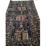 A Baluchi rug on navy ground with multi coloured design featuring three temples. W:104cm x H:197cm