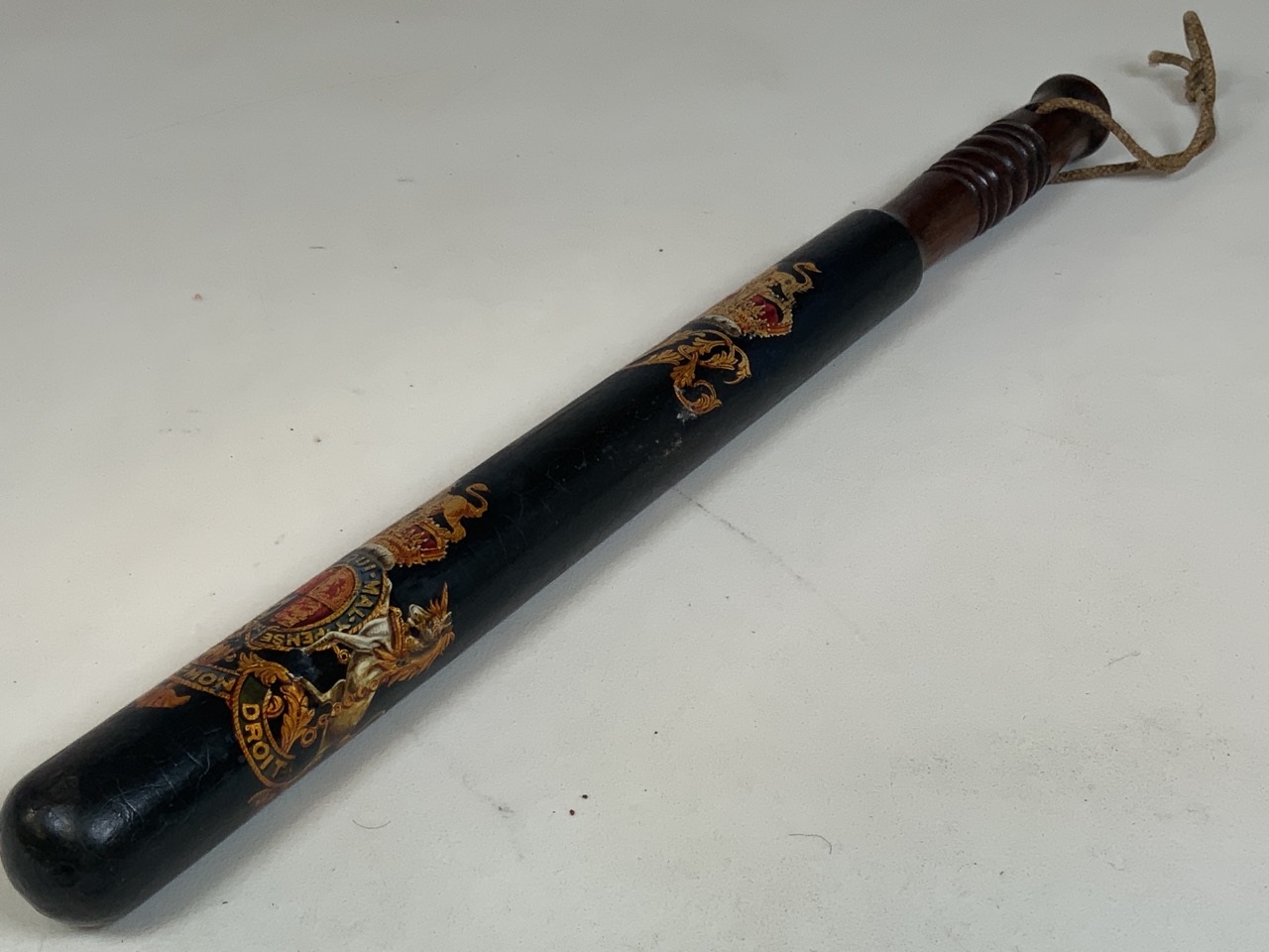 A decorated mahogany Victorian policemans truncheon. 46cm Length