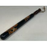 A decorated mahogany Victorian policemans truncheon. 46cm Length