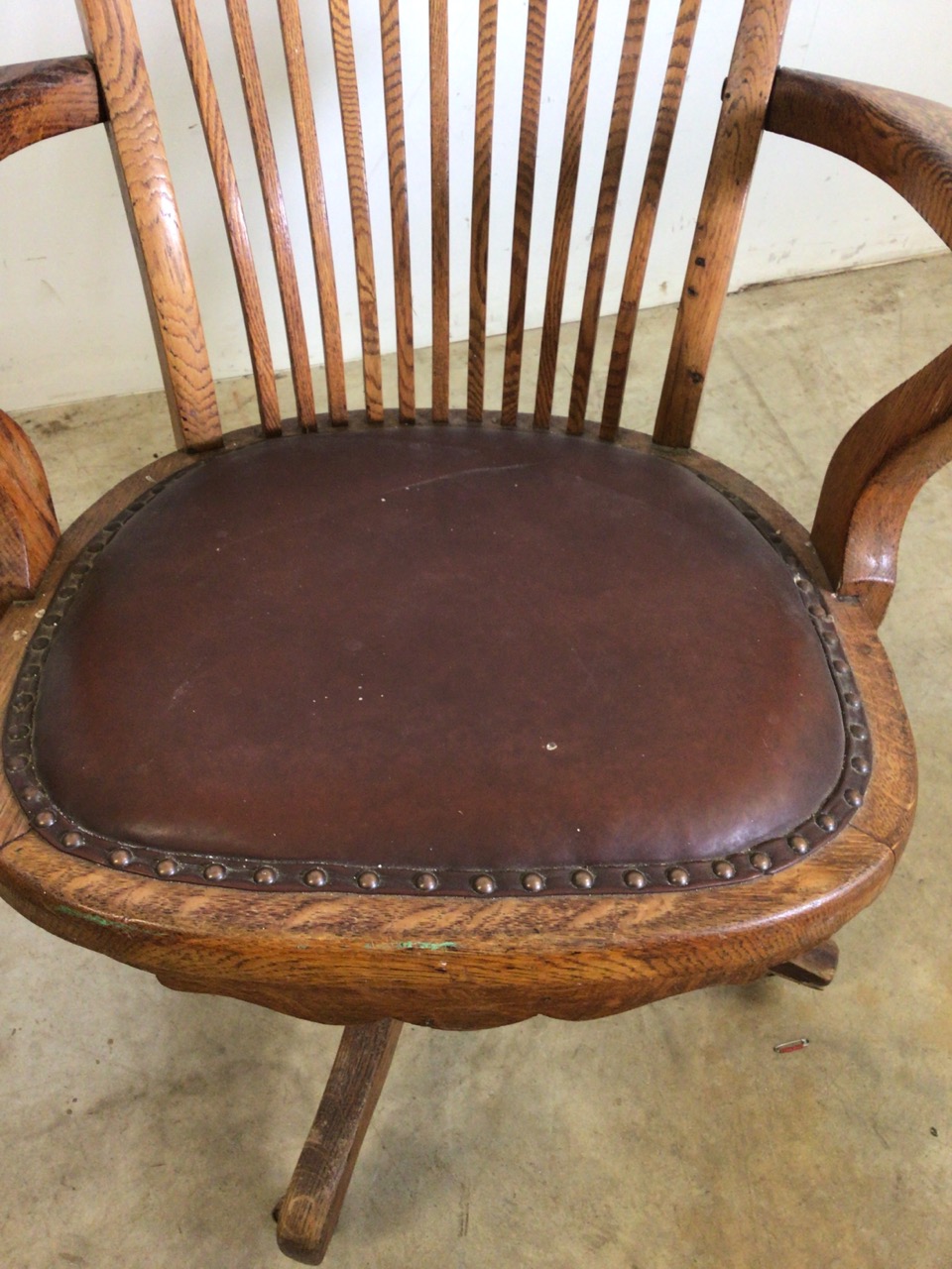 An early 20th century oak captains chair with tilt and swivel action, metal mechanics to base. - Image 6 of 11