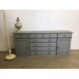 A modern pine painted dresser base also with a standard lamp and a table lamp. W:157cm x D:38cm x