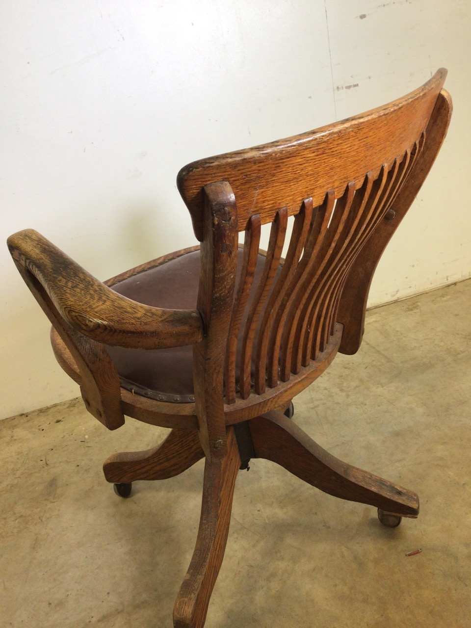 An early 20th century oak captains chair with tilt and swivel action, metal mechanics to base. - Image 8 of 11