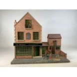 A dolls house Pub - The Huntsman with stable and outside shed, with furniture including bar
