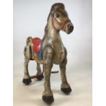 A metal bouncing horse by Mobo. With original paintwork. W:70cm x D:23cm x H:76cm