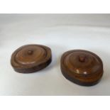 Two circular yew wood lidded circular treen bowls W:14cm x H:6.5cm