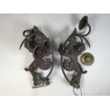 A pair of bronze down lighters or wall lights each with cast rampant lion by H. Luppens and Cie