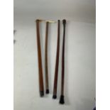 A collection of nineteenth century walking sticks including a silver collared carved stick, a carved