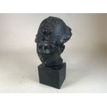 A painted plaster oriental style bust on square plinthW:22cm x H:43cm