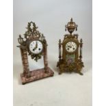 Pair of gilt and marble mantel clocks, of French taste. One suspended upon pillars of Rojo marble,