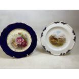 Two Royal Worcester hand painted cabinet plates. One with hand painted roses and the other with hand