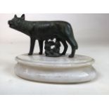 A spelter figure of a dog on marble oval plinth. W:16cm x D:9cm x H:11cm