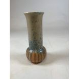 A Ruskin Pottery crystalline glaze vase decorated in merging orange, blue and beige glazes,