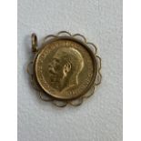 A 1918 full sovereign in 9ct gold mount.