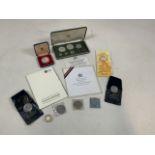 Assortment of commemorative coins, including British royal interest and a proof set of Trinidad