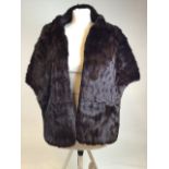 A vintage fur stole together with a Burberrys wallet and a clutch bag