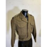 A vintage 1952 Captains military battle dress blouse from the Royal Army Education Corps in khaki