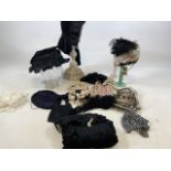 A collection of Victorian bonnets, hats muff, reticule, bibs, a mob cap and other items