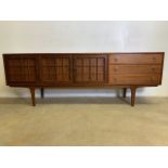 A mid century C.1960s teak sideboard by John Herbert for A Younger. Double cupboard doors to