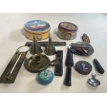 A collection of metalware including two nightlight holders with covers, a brass candle stick with