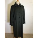 A vintage Hucclecote Leisurewaer Loden ladies full length coat. 75% wool 25% polyamide. Size 16