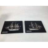 A pair of white metal ships mounted on black leather plaques entitled Fragata Holanda 1800 and