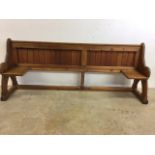 A pitch pine pew converted into a bedstead. W:215cm x D:50cm x H:87cm
