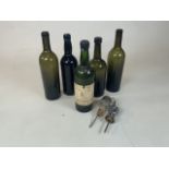 A collection of vintage wine bottles to include a Solera Madeira bottle with label