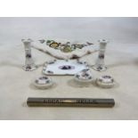 A mid century china dressing table set together with an embroidered table cloth and a metal tube