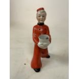 Art Deco German liquor decanter, painted figure of a hotel bellhop boy. Circa 1920/1930. Marked with