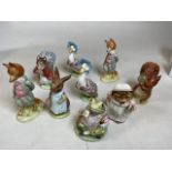 A collection of Beswick Beatrix Potter figures some early examples. Including a Foxy whispered