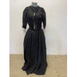 A collection of Victorian mourning items. To include skirts, tops, capes shawls, a lace scarf and