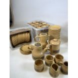 A quantity of Kiln Craft stoneware. 36 coffee mugs, saucers, side plates, coffee and tea pots