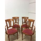 A set of four cherry wood dining chairs to include two carvers with upholstery seats.
