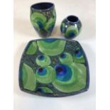 Janice Tchalenko for Dartington pottery, 'Peacock' four sided dish and two vases decorated in