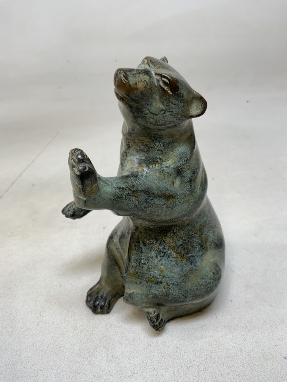 A ceramic study of a rearing bear H:17cm