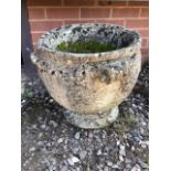 A large circular reconstituted stone planter.W:48cm x D:48cm x H:43cm