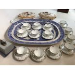 A large blue and white willow pattern meat plate also with Wedgwood turines, Harrods china cups
